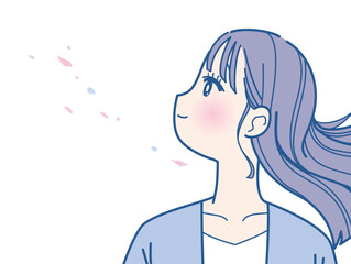 髪をなびかせる若い女性