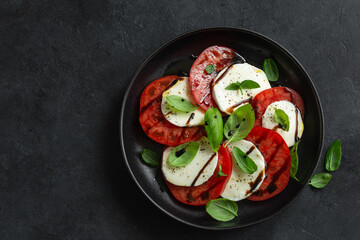 Fresh tomatoes, mozarella cheese  and basil. caprese salad