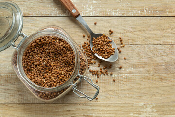 raw buckwheat grain in glass jar