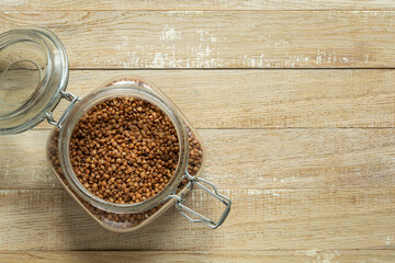 raw buckwheat grain in glass jar