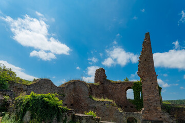Exploring ancient ruins beneath a vibrant sky in a forgotten landscape filled with stories and...
