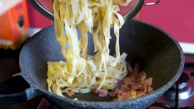 Pasta bacon cooking chef roasts cubes of bacon or Italian pork guanciale or pancetta in a pan for Italian pasta carbonara , A woman cooking Italian spaghetti carbonara pasta 