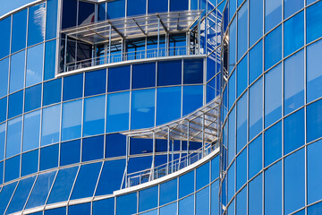 Cityscape on a sunny day. Modern building against the blue sky.