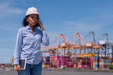 Industrial engineer workers operations marine port cranes loading and unloading of cargo ships...