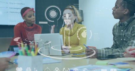 Brainstorming colleagues reviewing UI mockups in office meeting room, with holographic overlays