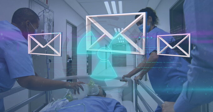 Medical team in blue scrubs pushing gurney in hospital corridor with mail icons and hazard overlay - Powered by Adobe