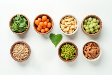 Organic  healthy  food  in  wooden  bowls,medical  stethoscope  and green  heart  shape  on  white  background  for  the  health  concept.Top  view