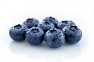 Set of eight ripe blueberries covered with water drops on white background. File contains clipping paths.