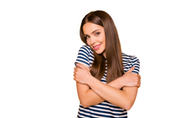 Portrait of charming youth hugging herself wearing white t-shirt isolated over yellow background