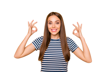 Portrait of cute pretty millennial in striped t-shirt showing ok sign advertising isolated over yellow background