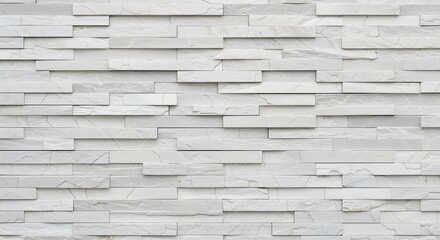 Obraz premium White stacked stone wall with natural texture and crack detail