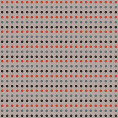Pattern created from rows of orange, grey-blue and black dots on a grey background