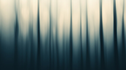 Misty forest with blurred trees creating an ethereal atmosphere during early morning hours