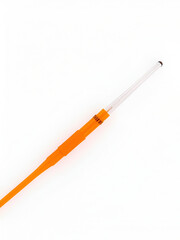 Orange intravenous cannula 14 G on white background, external diameter 2,1 mm, used in trauma, blood transfusion, surgery, ascites puncture.
