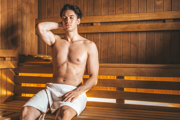 Young handsome man relaxing at camera relaxing at the spa resort - Health care and luxury activities life style concept