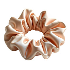 A close up of a peach colored satin scrunchie on isolated on transparent background