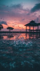 Water splash at sunset, pavilion reflection