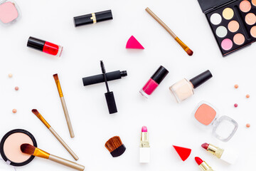 Flatlay of makeup cosmetics on white background. Blusher, mascara and lipstick, top view
