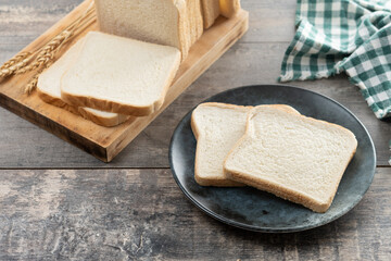 Slices of White Bread on wooden table