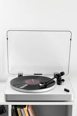 Close-up of a vinyl record playing on a modern turntable. Stylish and minimalistic.