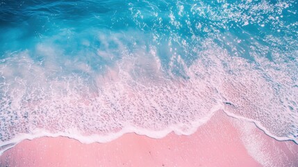 The blue and pink beach, with two or three small flowers dotting the picture. The background is the sparkling water, with thin strips of white foam, creating a bird's-eye view. The picture has soft to