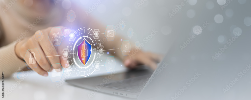 Poster user touching a holographic cybersecurity interface with digital shield icon for data protection.