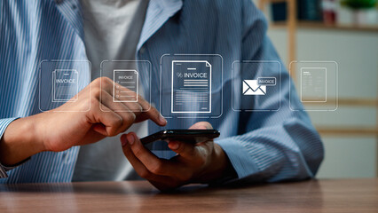 E-Invoice and Digital billing concept, Businessman using laptop to manage electronic statements on virtual screen. E-tax, Digital receipt, Online invoice processing and tax accounting solutions.