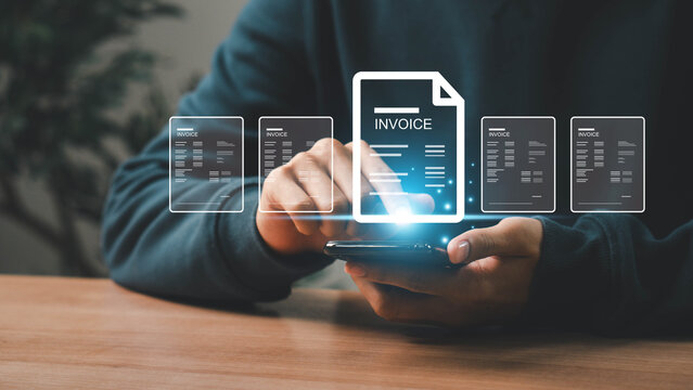 E-Invoice and Digital billing concept, Businessman using laptop to manage electronic statements on virtual screen. E-tax, Digital receipt, Online invoice processing and tax accounting solutions.