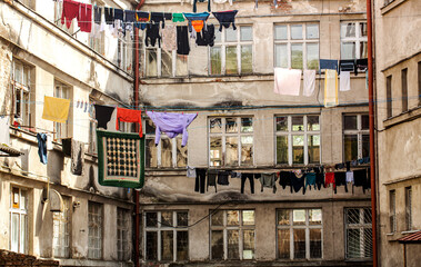 Poor district. Washed clothes drying outside of an old house. Poor district, houses of a poor...