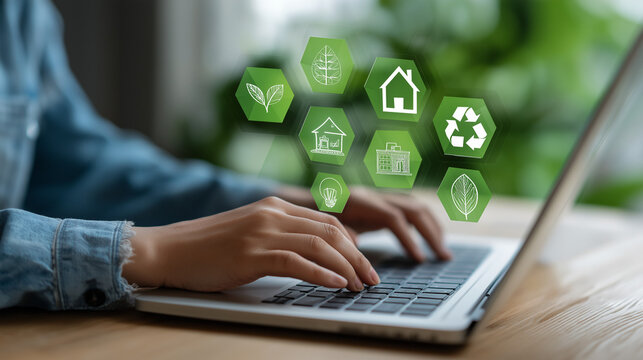 Green Tech Interface: A person wearing denim uses a laptop with icons such as a plant light bulb, a recycling symbol, and a leafy house, emphasizing eco-friendly initiatives. - Powered by Adobe