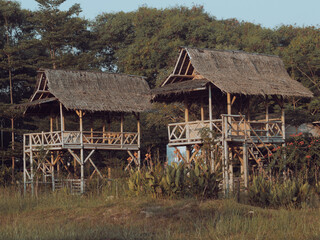 Hut in a park. This hut is made using bamboo and straw as the roof. A place to relax.