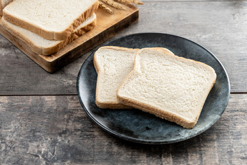Slices of White Bread on wooden table