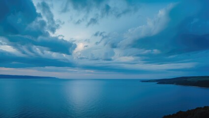 Blue sky and blue sea with landscape, featuring empty space for text.