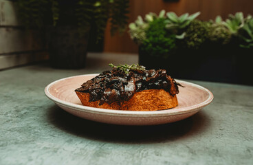 Sourdough topped with mushroom and port.