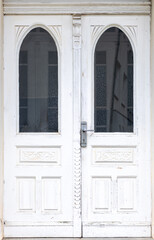 White vintage door. Arched stained glass. Retro entrance
