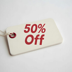 red sale tag 50 % off on black background