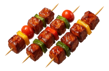 Grilled tofu skewers with glossy vegetables including cherry tomatoes, yellow and green bell peppers.