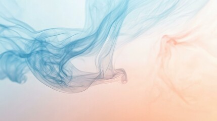 Naklejka premium Swirling blue and peach smoke in serene studio setting