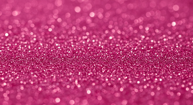 Close-up shot of sparkling pink glitter background with bokeh effect for festive designs