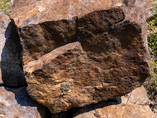 A large rock sitting on top of a pile of rocks