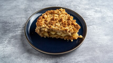 A delectable slice of apple crumble, showcasing its irresistible crumbly topping and the juicy, tender apples within. A perfect autumn dessert, this homemade treat is both comforting and satisfying.