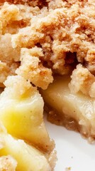 Apple Crumble: A Close-Up View of a Delicious, Golden Brown Crumble Topping and Juicy Apple Filling. This Sweet Treat is Perfect for Autumn and a Delightful Dessert for Any Occasion.
