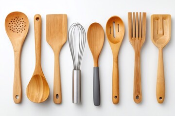 Wooden kitchen utensils forming a straight line on white background