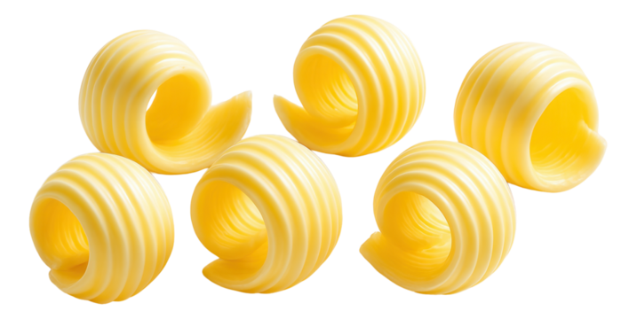 Six decorative curls of butter with smooth, ribbed patterns.