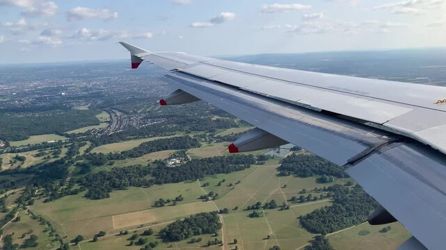 Flying over England on approach to Heathrow , London 