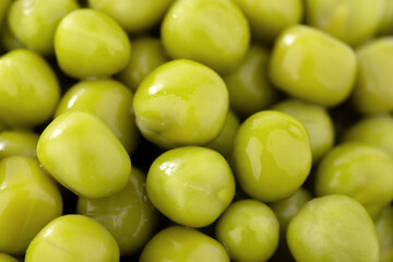 Fresh green peas background, texture of perfect peeled sweet pea grains as background. Vegetable background, vegetable protein, healthy products. Canned peas. spinning in a circle