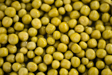 Fresh green peas background, texture of perfect peeled sweet pea grains as background. Vegetable background, vegetable protein, healthy products. Canned peas. spinning in a circle