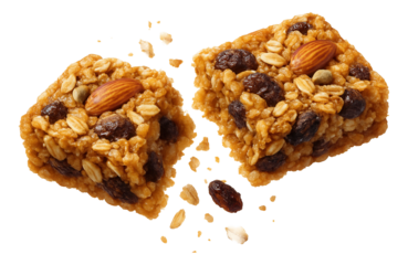 A broken granola bar with oats, almonds, raisins, and pumpkin seeds, crumbling into pieces.