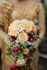 Elegant Cascading Bridal Bouquet Peach Roses, Baby's Breath, and Red Accents