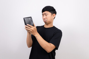 Poor asian man feel sad with no money in his wallet isolated